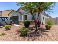Charming single-Gathering home featuring low maintenance desert landscaping and a two car garage at 37287 N Azteca Rd, San Tan Valley, AZ 85140