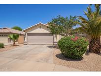 Charming home featuring a two-car garage, well-maintained landscaping, and a welcoming entrance at 3821 N 125Th Dr, Avondale, AZ 85392