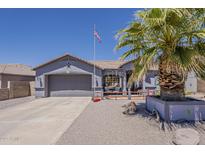 Charming single-story home featuring a well-maintained front yard and two-car garage at 6154 S Borego Rd, Gold Canyon, AZ 85118