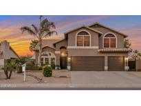 Charming home featuring desert landscaping, a tile roof, and a spacious three car garage at 630 W Saragosa St, Chandler, AZ 85225