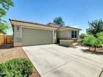 Charming one-story home with a two-car garage and low-maintenance desert landscaping at 8140 W Lane Ave, Glendale, AZ 85303