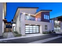 Modern home featuring a balcony and garage with glass panel door at 1 Easy St # 17, Carefree, AZ 85377