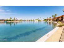 Beautiful view of the large community lake and landscaping on a bright, sunny day at 10330 W Thunderbird Blvd # B112, Sun City, AZ 85351
