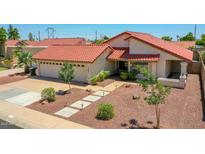 Beautiful single-story home featuring a red tile roof and a well-manicured desert landscape at 12641 S 39Th Pl, Phoenix, AZ 85044