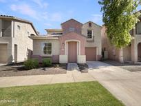 Charming two-story home with a well-maintained lawn and a classic, inviting entrance at 1415 E Chipman Rd, Phoenix, AZ 85040