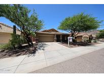 Charming single-Gathering home featuring a well-maintained yard, desert landscaping, and a spacious two-car garage at 5130 W Molly Ln, Phoenix, AZ 85083