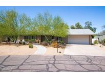Charming single-story home featuring drought-resistant landscaping and a two car garage at 851 E Village Circle N Dr, Phoenix, AZ 85022
