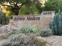 Community sign at Arroyo Madera with desert landscaping and address at 9070 E Gary Rd # 152, Scottsdale, AZ 85260