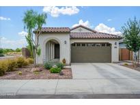 Charming single-story home featuring a two-car garage and desert landscaping at 9238 W Roma Ave, Phoenix, AZ 85037