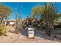 Inviting home exterior featuring desert landscaping and a stone-accented entrance at 2661 E Birchwood Pl, Chandler, AZ 85249
