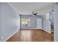 The living room boasts a ceiling fan and a large window providing natural light at 2954 N Oregon St # 6, Chandler, AZ 85225