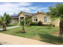 Charming single story home featuring a well-maintained lawn and mature landscaping in a sunny neighborhood at 3116 W Dailey St, Phoenix, AZ 85053