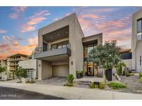 Stunning modern home with a balcony, mature landscaping, and a private two-car garage at 4938 N Ascent Dr, Scottsdale, AZ 85251