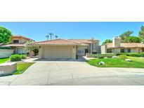 Charming single-Gathering home with a well-manicured lawn and desert landscaping in a desirable neighborhood at 5431 E Piping Rock Rd, Scottsdale, AZ 85254