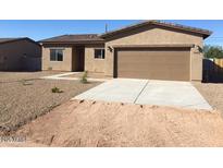 Charming single-story home featuring a well-manicured lawn and a two-car garage at 5471 E Santa Clara Dr, San Tan Valley, AZ 85140