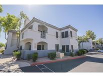 Exterior of multi-Gathering home with light stucco, tile roof, and covered patio at 600 W Grove Pkwy # 2188, Tempe, AZ 85283