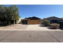 Charming single-story home with low maintenance landscaping and a private two-car garage at 990 E Desert Rose Trl, San Tan Valley, AZ 85143