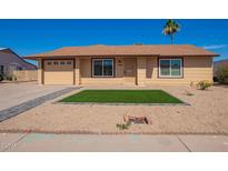 Charming single-story home with a well-manicured front yard and desert landscaping at 1430 N Ashland --, Mesa, AZ 85203