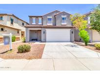 Charming two-story home with a spacious two-car garage and well-maintained landscaping at 31269 N Cavalier Dr, San Tan Valley, AZ 85143