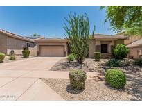 Charming single-story home with a two-car garage and desert landscaping at 35729 N 32Nd Ave, Phoenix, AZ 85086