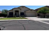 Charming single-Gathering home with a well-maintained lawn, mature tree, and a two car garage at 4525 E Runaway Bay Dr, Chandler, AZ 85249