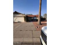 Charming single story home featuring a convenient two car garage and drought tolerant landscaping at 8401 E San Miguel Ave, Scottsdale, AZ 85250