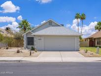 Charming single-story home with a well-maintained front yard and a two-car garage in a desirable neighborhood at 10613 S 41St Pl, Phoenix, AZ 85044