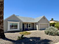 Charming single-story home with manicured front yard and attached garage, providing comfortable living and curb appeal at 1319 E Piute Ave, Phoenix, AZ 85024