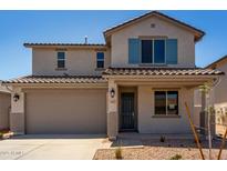 Charming two-story home featuring a tile roof, neutral stucco, and desert landscaping at 31822 N Bandit Rd, San Tan Valley, AZ 85143