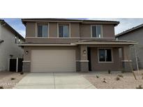 Two-story home with a two car garage and neutral colored stucco finish, complemented by a well-maintained yard at 31850 N Bandit Rd, San Tan Valley, AZ 85143
