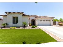 Charming single-story home with well-maintained lawn and desert landscaping at 6317 S Banning St, Gilbert, AZ 85298