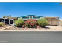 Charming single-story home with lovely landscaping, covered parking, and light blue trim at 8103 E Southern Ave # 170, Mesa, AZ 85209