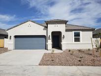 Charming single-story home with blue garage door, desert landscaping and covered entryway at 8422 W Mantle Way, Florence, AZ 85132