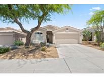 Charming single-story home with well-maintained landscaping, desert accents and a two-car garage at 8848 E Conquistadores Dr, Scottsdale, AZ 85255