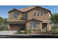 Stunning two-story home featuring a tan stucco exterior, brown garage door, and well-manicured landscaping at 17166 W Oberlin Way, Surprise, AZ 85387