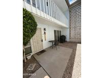 Inviting patio featuring a table, grill, and access to upper balcony, perfect for relaxing or entertaining at 1734 W Tuckey Ln # 14, Phoenix, AZ 85015