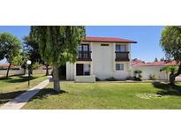 Charming two-story home with a red tile roof and front yard at 2831 E Waltann Ln # 1, Phoenix, AZ 85032