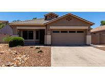 Charming single-story home featuring a low maintenance desert landscape and a two-car garage at 3719 E Sandy Way, Gilbert, AZ 85297