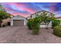 Charming home featuring a well-maintained front yard and a two-car garage with a spacious driveway at 3884 S Wilson Dr, Chandler, AZ 85286