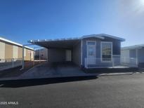 Charming single-Gathering home with carport, small front porch and well-maintained landscaping at 650 N Hawes Rd # 3312, Mesa, AZ 85207