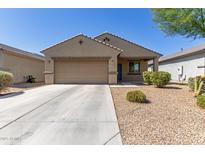 Charming single-story home featuring a neutral color palette, desert landscaping, and an attached two-car garage at 7224 W Puget Ave, Peoria, AZ 85345