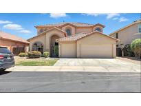 Charming two-story home with a well-maintained front yard and a two-car garage at 7243 W Sandra Ter, Peoria, AZ 85382