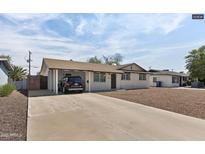 Charming single-story home with a covered carport and low maintenance desert landscaping at 1321 W 14Th St, Tempe, AZ 85281