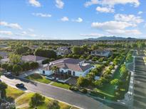 Expansive aerial view showcasing the home's well-maintained landscaping, mature trees, and desirable neighborhood setting at 3354 E Jaeger Cir, Mesa, AZ 85213