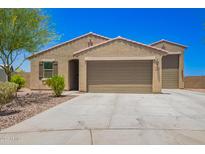 Charming single-story home featuring desert landscaping and a two-car garage at 4654 W Suncup Dr, San Tan Valley, AZ 85144
