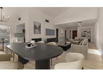 Bright living space with modern decor, fireplace, and hardwood floors providing a warm and inviting atmosphere at 1610 N Apache Dr, Chandler, AZ 85224