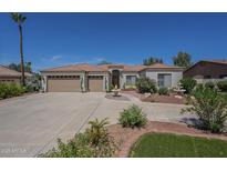 Charming single-story home with a well-manicured front yard and large driveway at 17770 N 66Th Ln, Glendale, AZ 85308