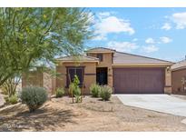 Charming single-story home with desert landscaping and a spacious two-car garage at 18333 N Presley Ln, Maricopa, AZ 85138
