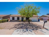 Charming single-story home featuring a well-manicured front yard, desert landscaping, and inviting curb appeal at 215 S 132Nd St, Chandler, AZ 85225