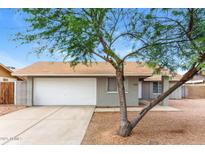Charming single-story home featuring a two-car garage, painted brick, and low maintenance landscaping at 5533 W Sunnyside Dr, Glendale, AZ 85304